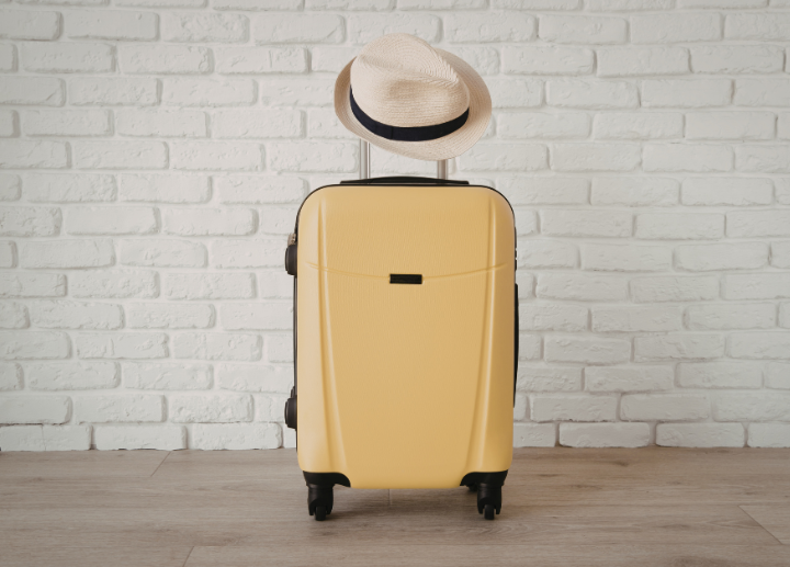 suitcase with hat on top