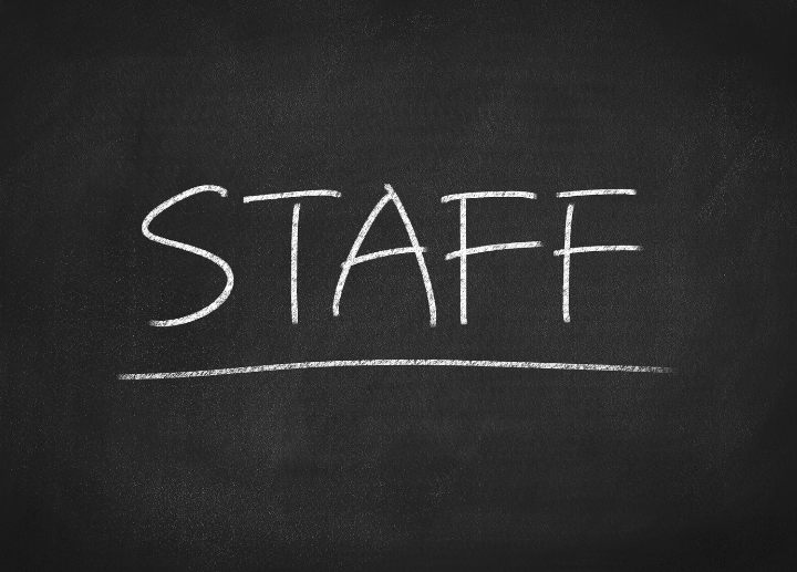 STAFF written in white chalk on blackboard