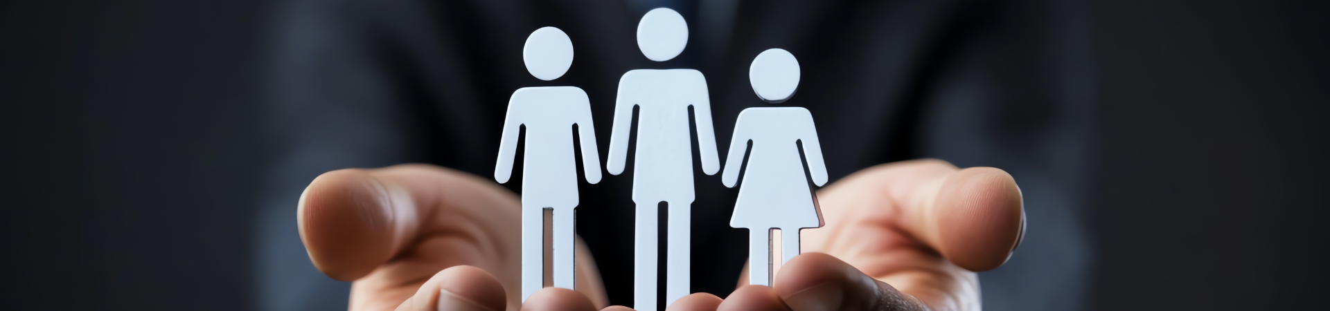 hands holding images of 3 people
